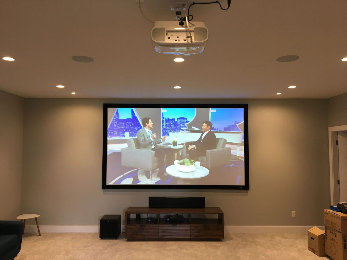 Home theatre projector running in a finished basement
