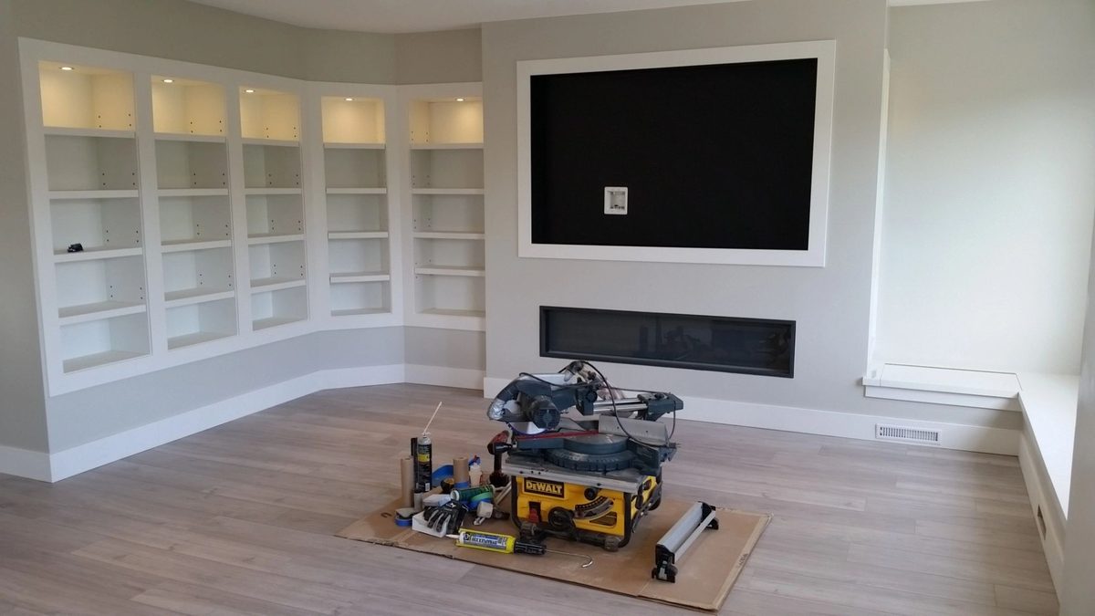 TV built into custom white cabinetry